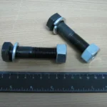 Кріплення зуба ковша