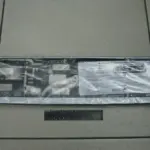 Рамка номерного знака з засувкою