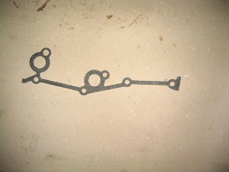 Прокладка кришки ланцюга ЗМЗ 406 ліва (вир-во ЗМЗ)