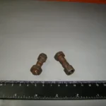 Гвинт регулювальний коромисел клапанів ЗИЛ з гайкою в зб.